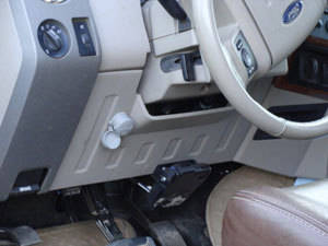 The interior of a vehicle with a Ravelco plug securely mounted to thwart car thieves every time.